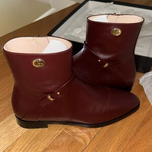 Dark burgundy Gucci boots size 8. New in box. Never worn. Make offer!